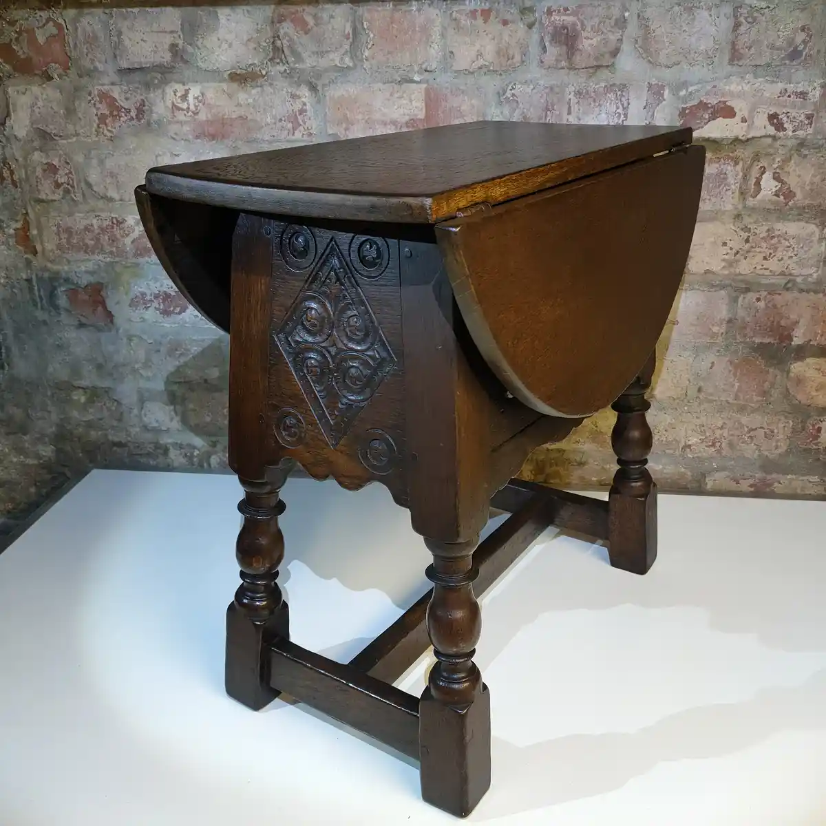 Discover the Charm of an Antique Swivel Top Drop Leaf Table