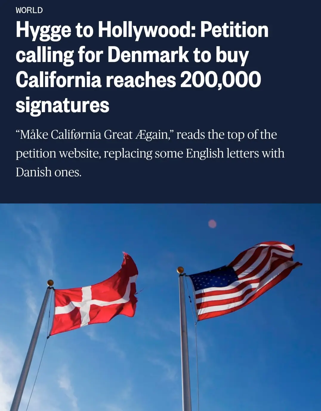 The image shows two flags, the Danish flag on the left and the American flag on the right, waving against a blue sky…