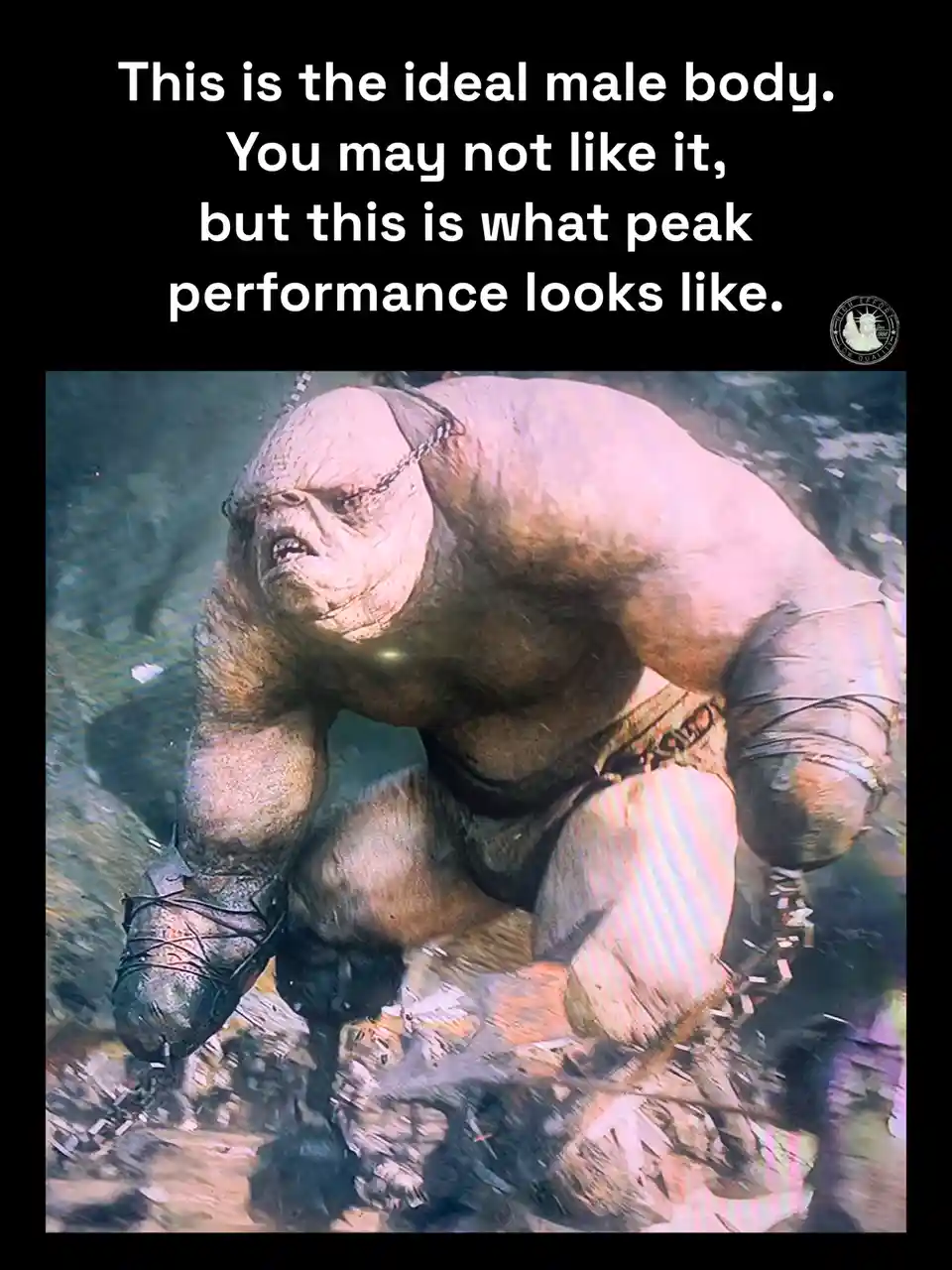 The image shows a grotesque, heavily muscled humanoid creature with a distorted, angry face, wrapped in chains and bandages…
