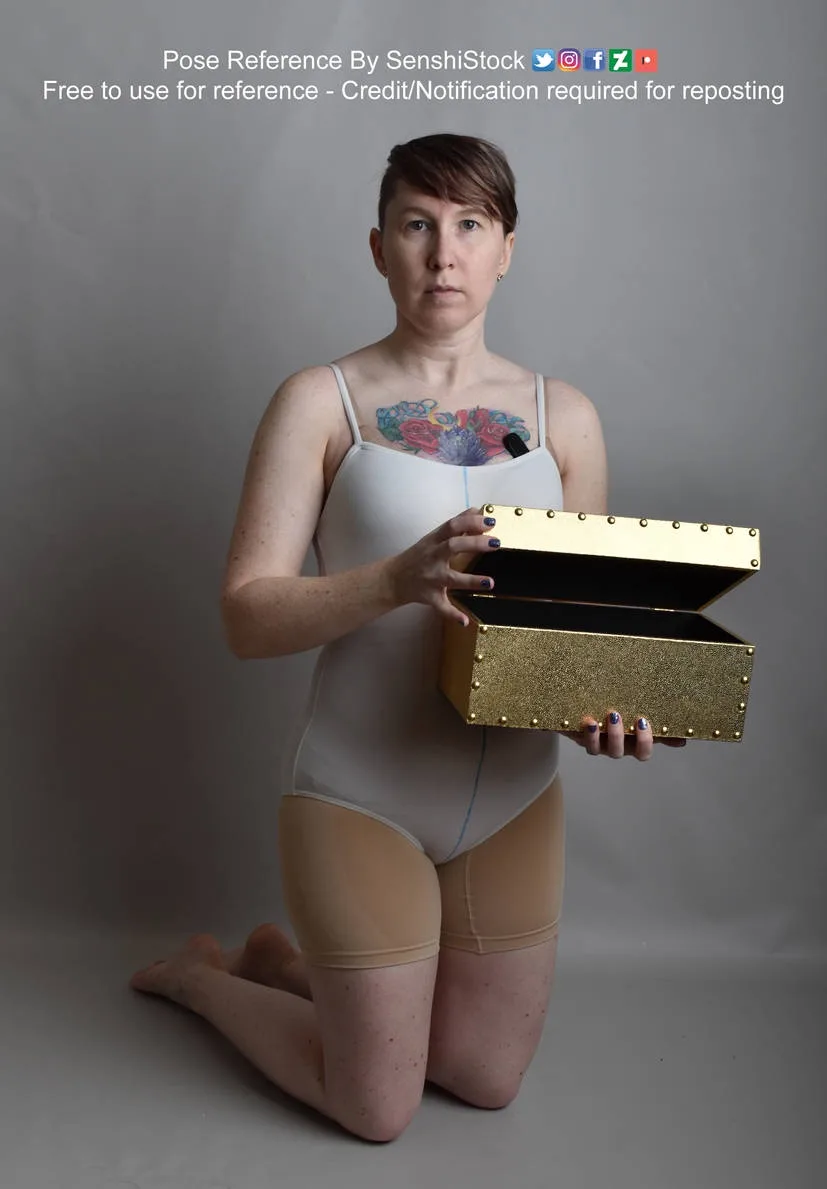 A woman kneels on a gray floor holding an open, glittery gold box. She wears a white bodysuit and beige tights, with a…