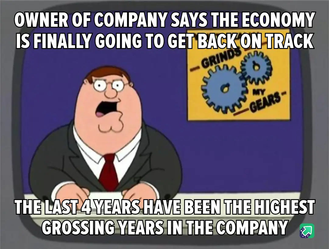 A cartoon man in a suit and tie sits at a desk with a shocked expression, looking at the viewer. Behind him, a yellow poster…