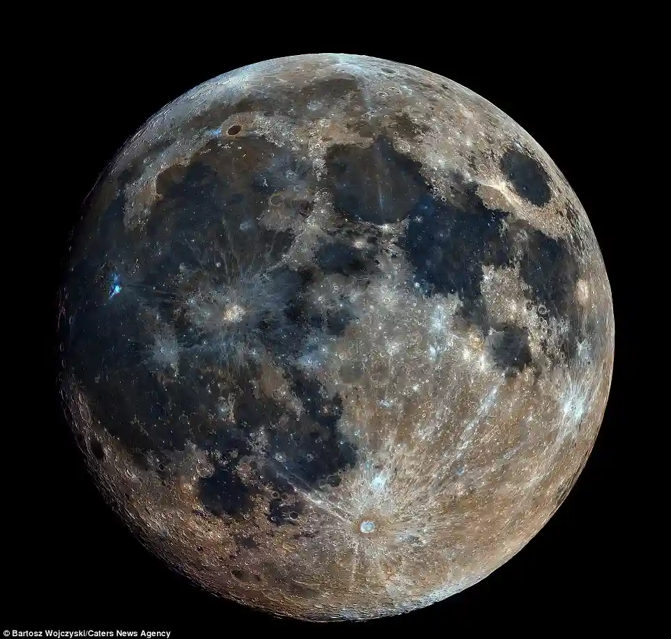 A high-resolution image of the moon's surface, showing craters, maria, and varied terrain against a black background…