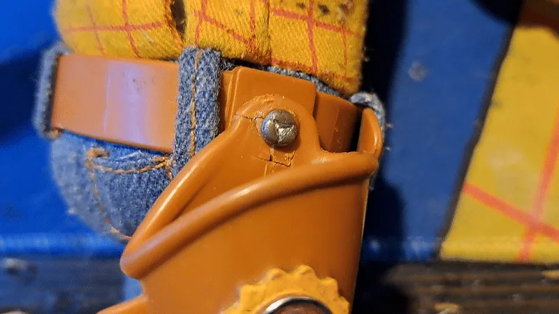 This meme consists of six close-up frames showing a small screw head on a toy boot, which appears to subtly shift position…