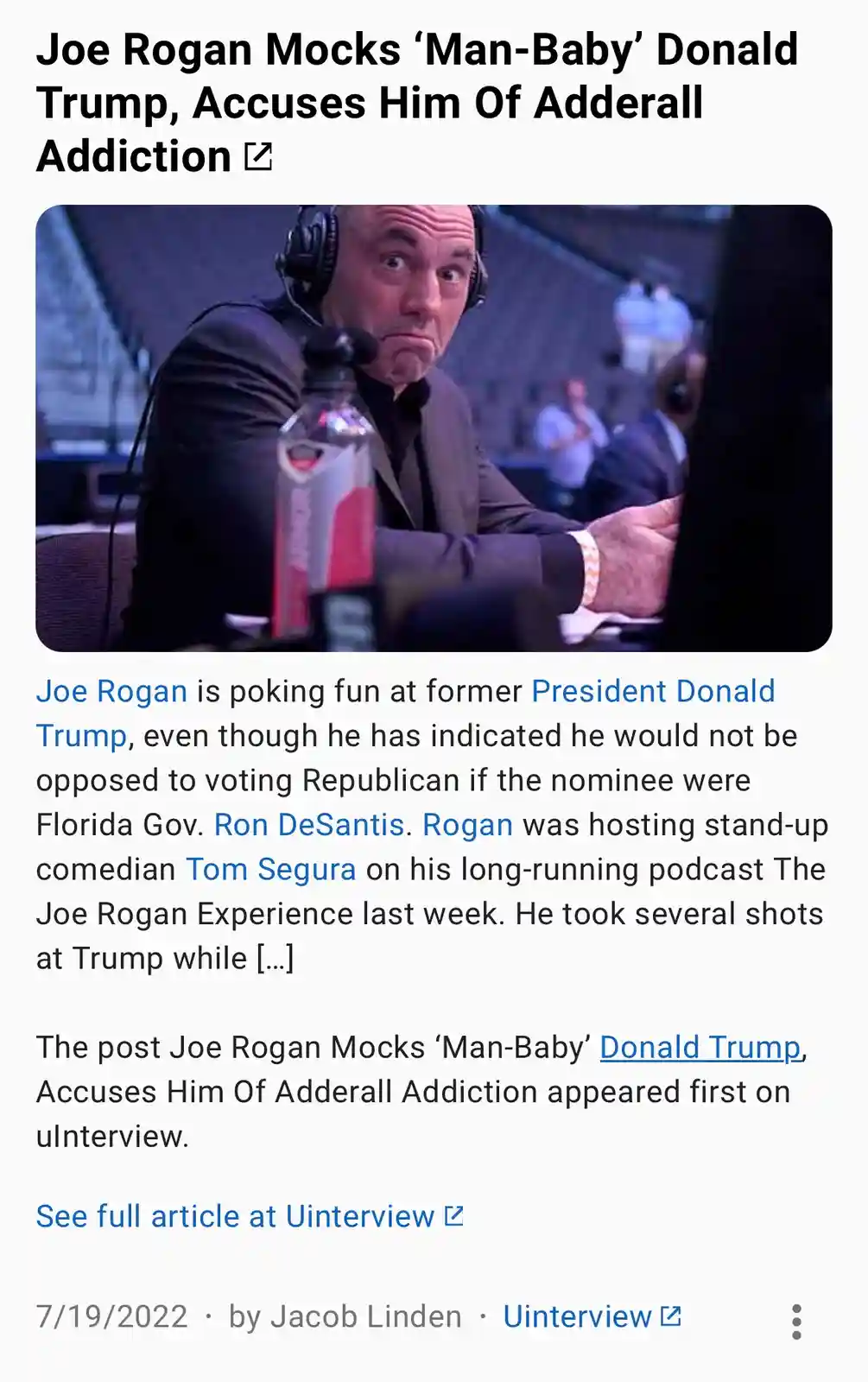 A screenshot from a news article shows a photo of Joe Rogan wearing headphones and looking intensely at a computer screen…