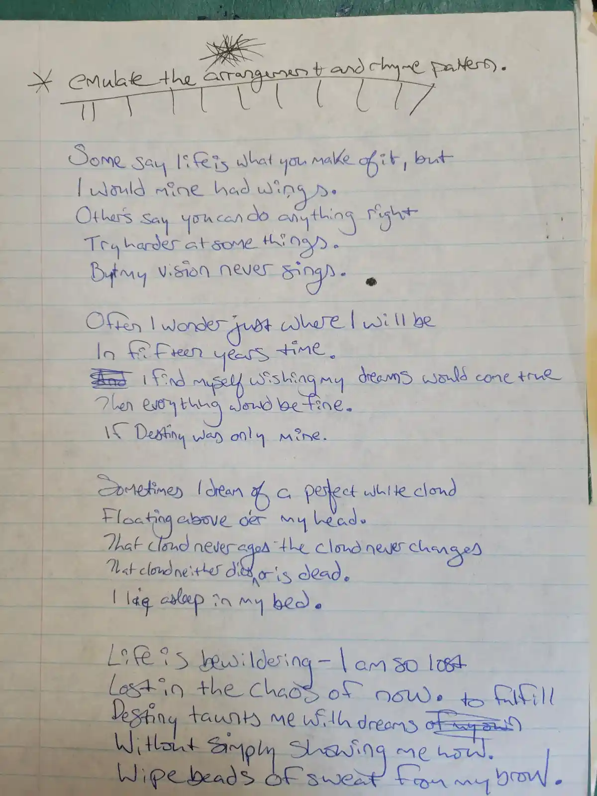 A handwritten poem on lined notebook paper, with the top line crossed out and replaced with 'Emulate the arrangement and…