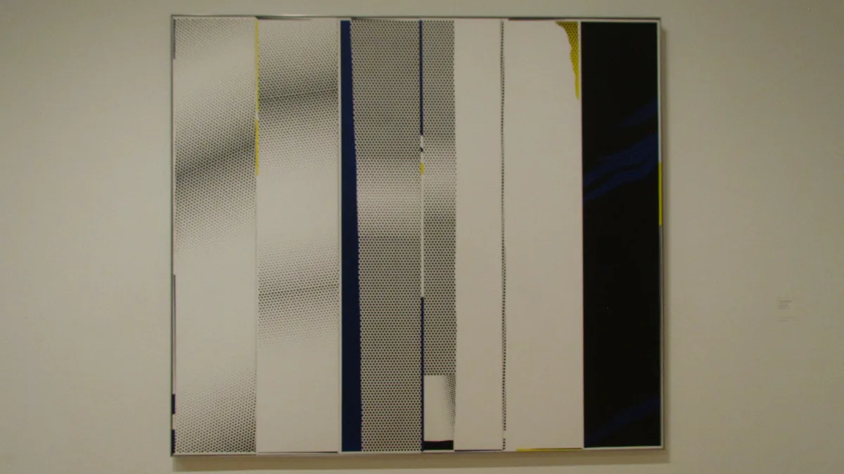 a large abstract painting by roy lichtenstein hangs on a plain wall, featuring vertical panels with halftone dot patterns in…