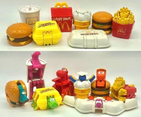 The image displays two rows of McDonald's Happy Meal toys. The top row shows the original, unopened plastic toys: a…