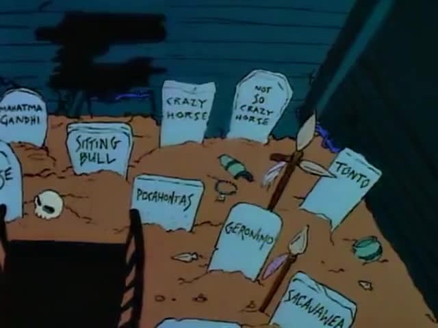 A cartoon graveyard scene with tombstones for historical and fictional figures like 'Crazy Horse', 'Sitting Bull'…