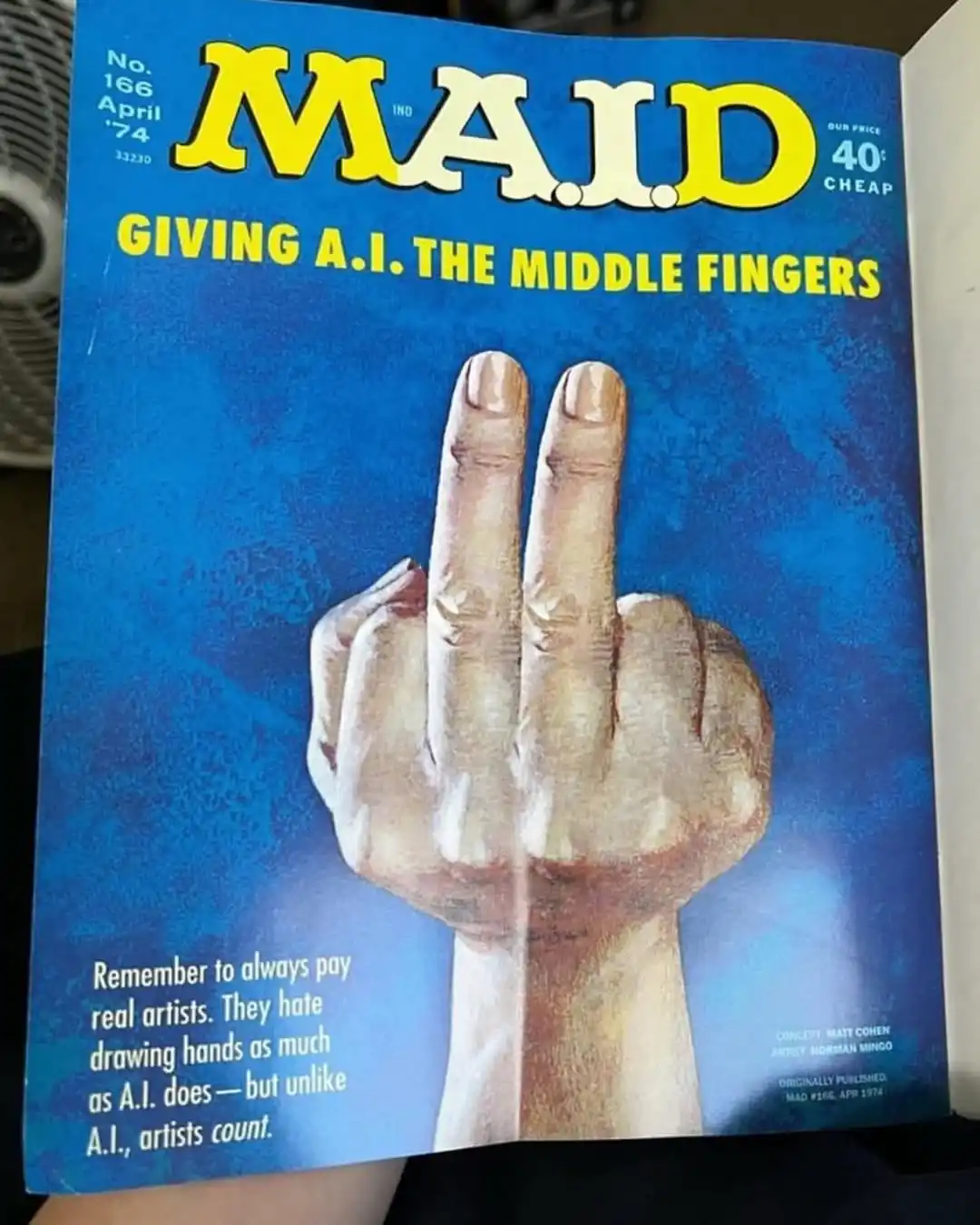 The image shows the cover of MAD magazine issue #166 from April 1974, featuring a large, detailed illustration of a hand…