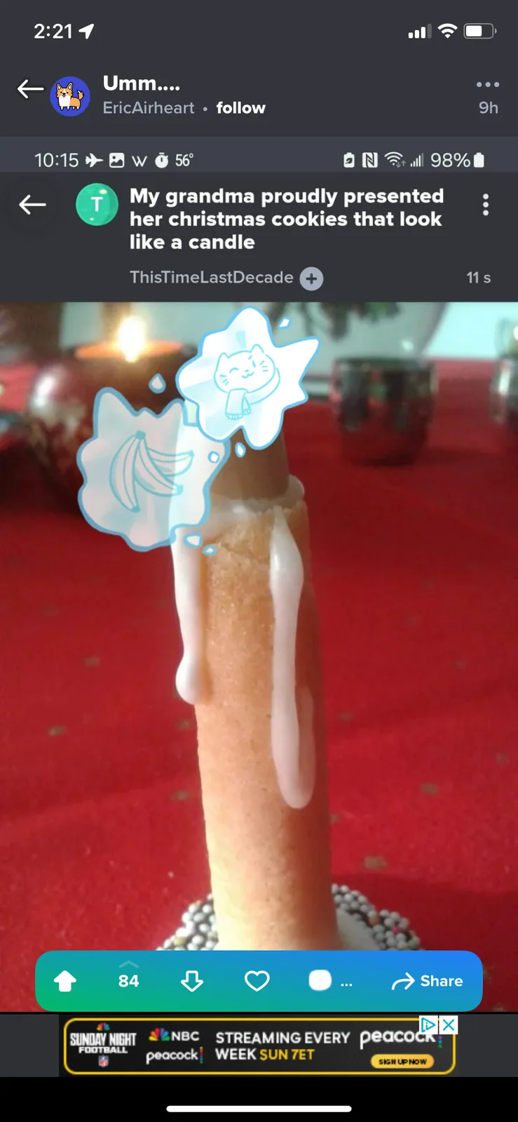 A close-up photo shows a cookie shaped like a candle with white icing dripping down its sides, placed on a red tablecloth…