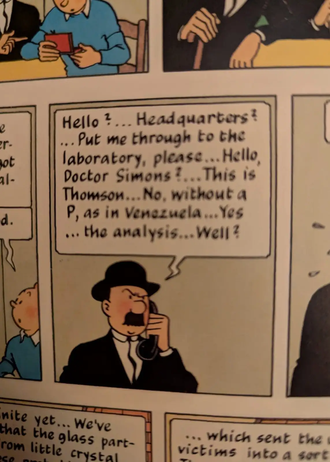 A comic strip panel shows a man in a bowler hat and suit on the phone, looking frustrated. His speech bubble reads: 'Hello ?…