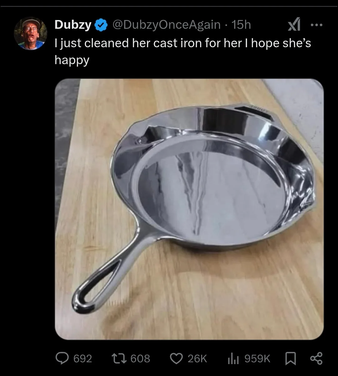 A highly polished, mirror-like cast iron skillet sits on a wooden cutting board, reflecting its surroundings. The overlaid…