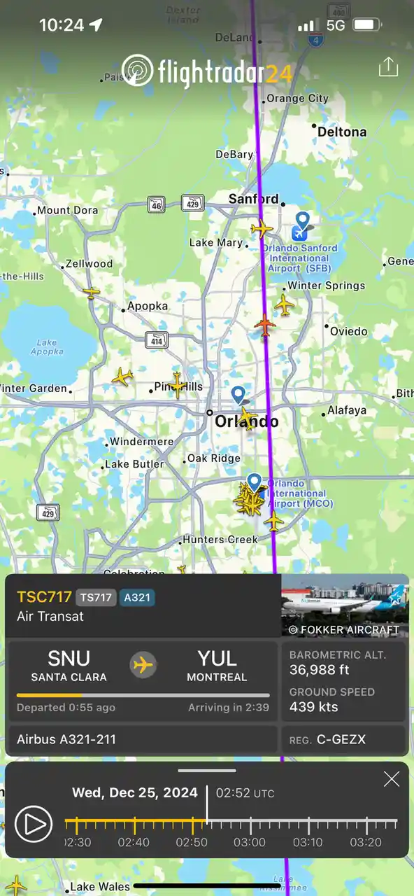 A Flightradar24 screenshot shows an Air Transat flight (TSC717) flying at 36,988 feet over Orlando, Florida, with a ground…