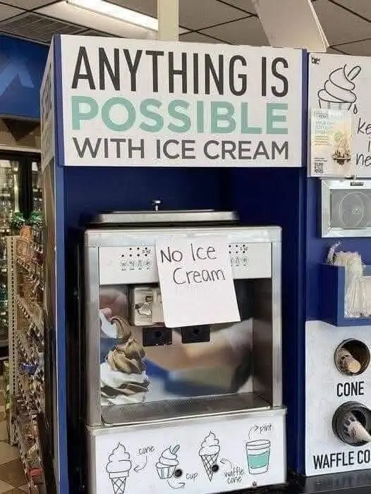 A commercial ice cream freezer machine with a large sign above reading 'ANYTHING IS POSSIBLE WITH ICE CREAM'. A handwritten…