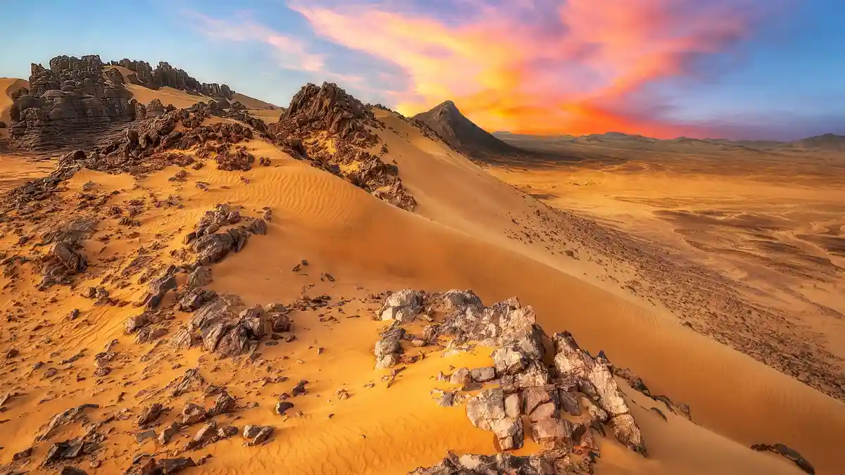 Algeria's vast desert landscape stretches across northern Africa, covering nearly a million square miles. Tin Akachaker's…