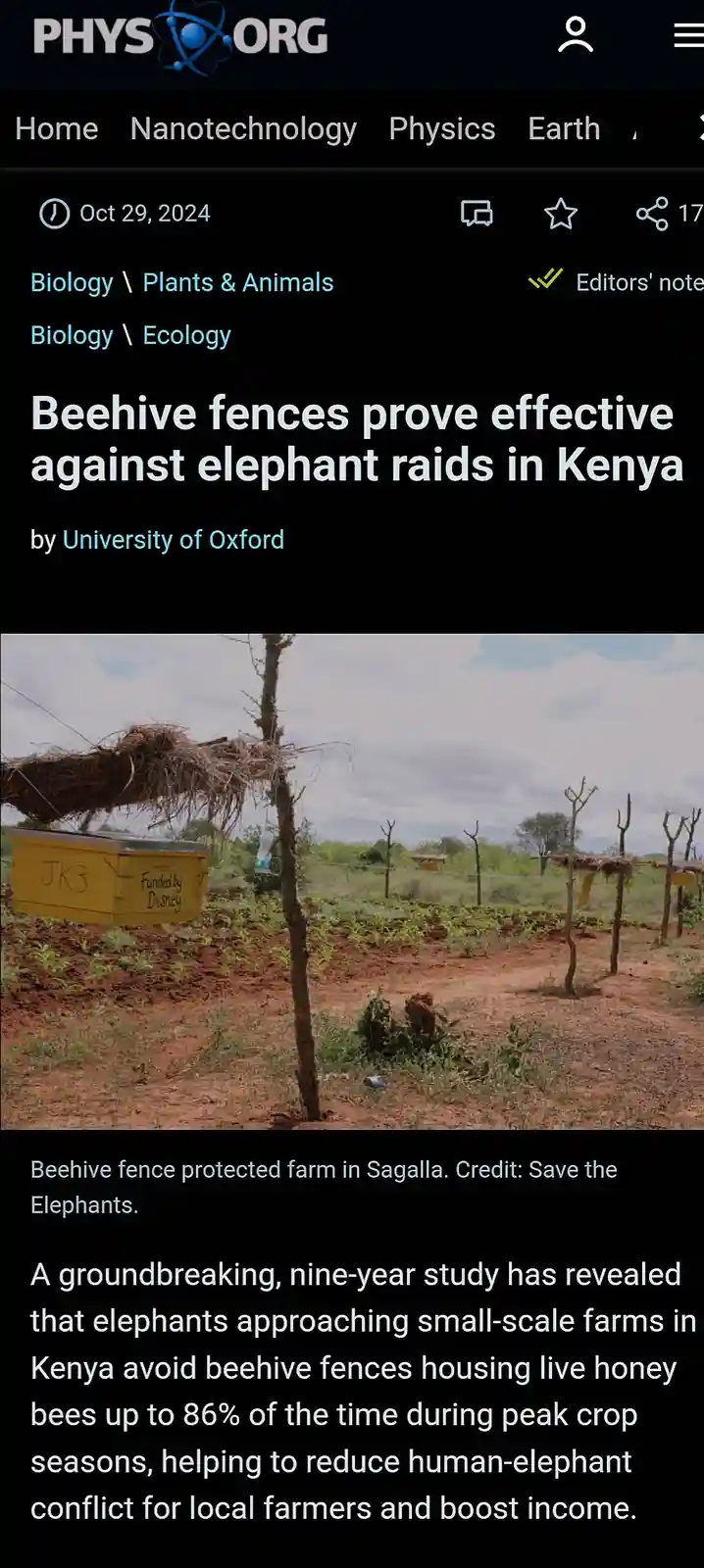 A screenshot of a Phys.org news article from October 29, 2024, featuring a photo of a beehive fence in Kenya. The image…