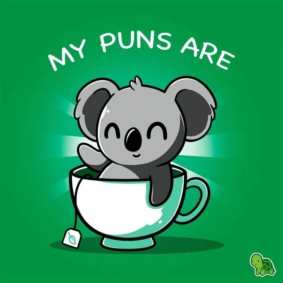 A cartoon koala with a happy, winking expression is sitting inside a white teacup with a green rim and a tea bag tag hanging…