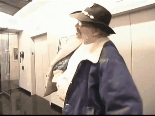 A six-panel sequence shows a man in a hat and coat walking down a hallway, then leaning against a wall, collapsing to the…