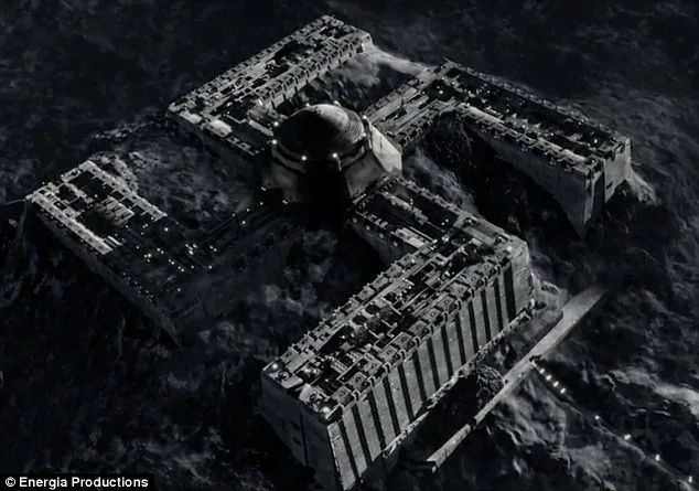 a black-and-white aerial shot of a massive, partially submerged, cross-shaped structure in turbulent water, resembling a…