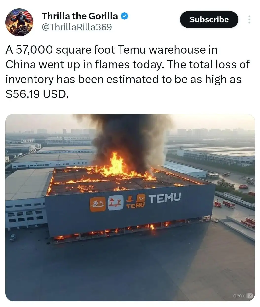 An aerial photo shows a large warehouse with 'TEMU' branding on its side engulfed in flames and thick black smoke. The…