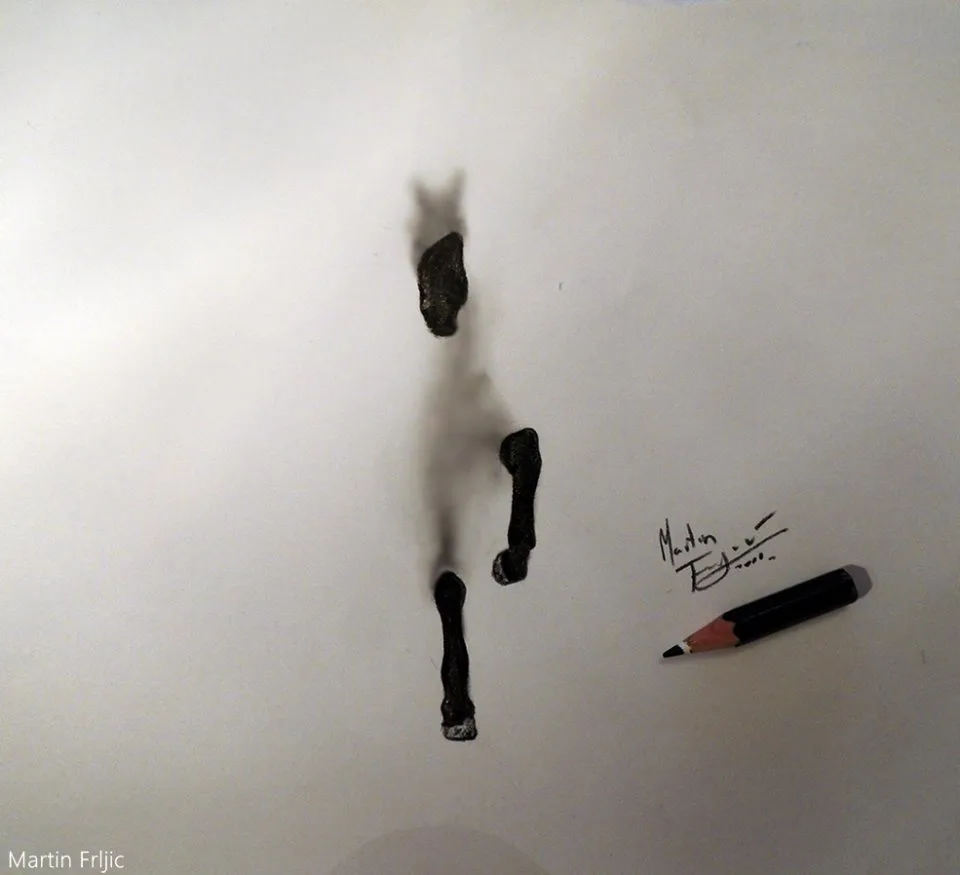 A close-up photo of a white surface with three dark, smudged, vertically aligned marks resembling a crude drawing of a…