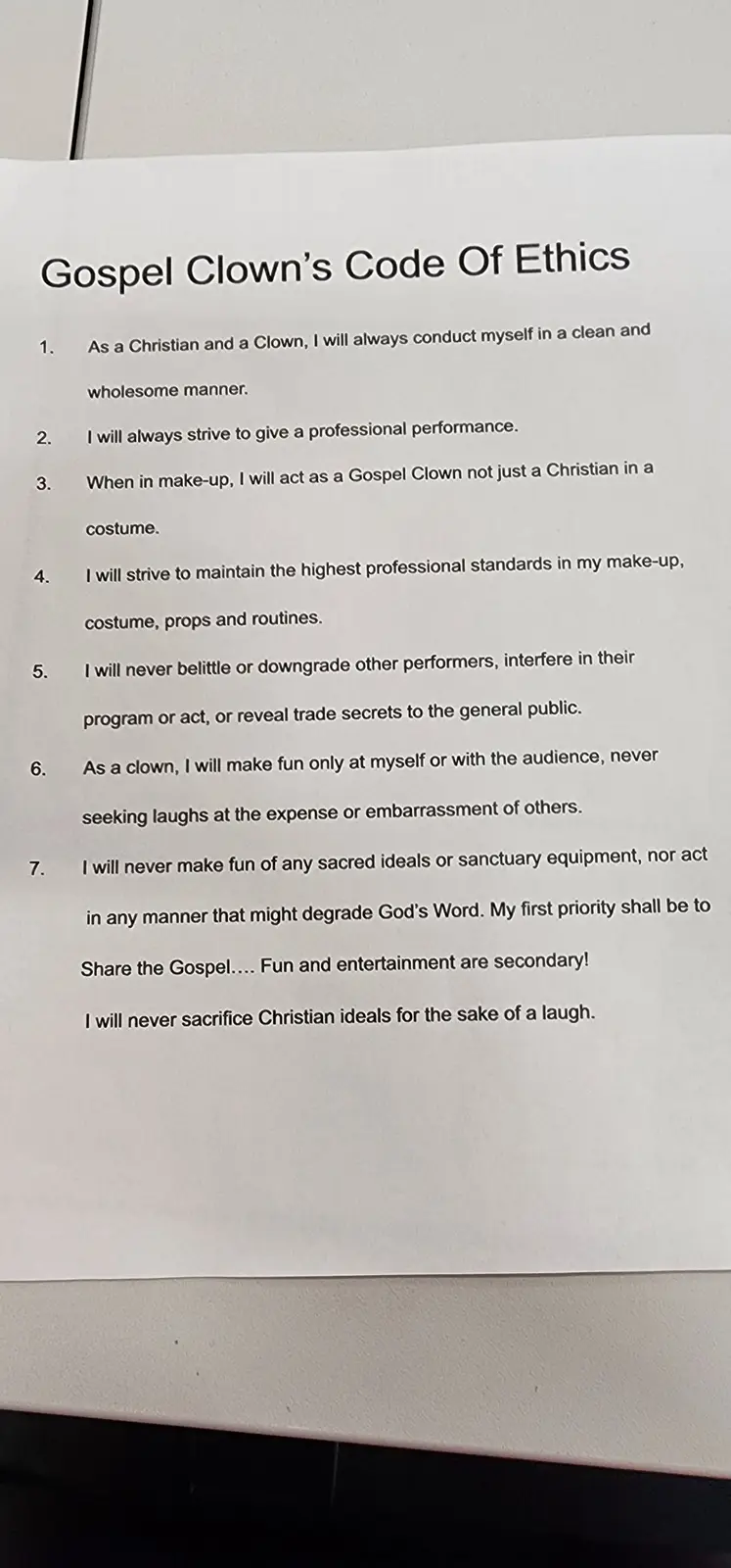 A printed document titled 'Gospel Clown's Code Of Ethics' lists seven rules for clowns who are also Christians, emphasizing…