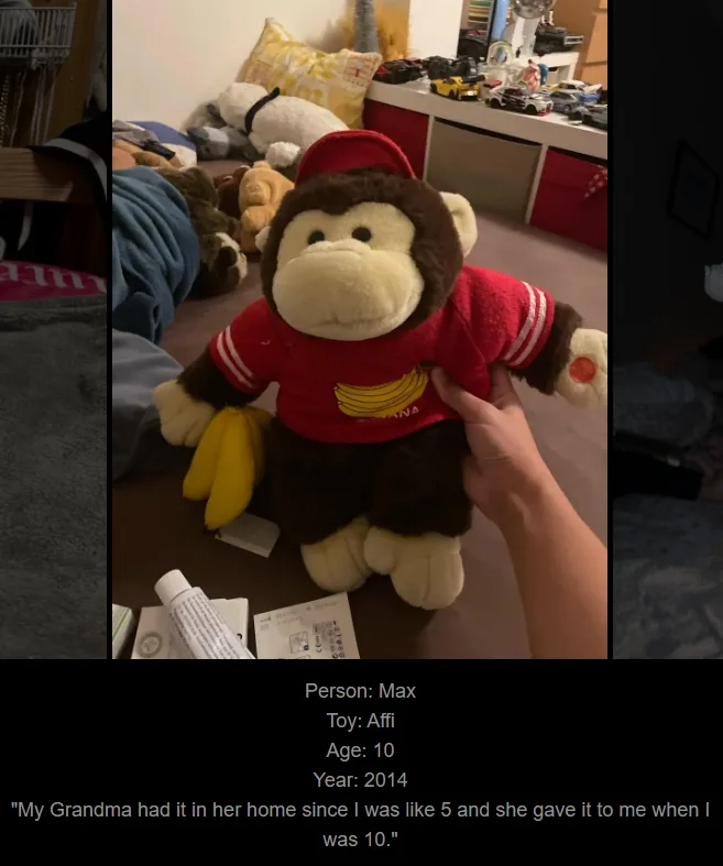 A person's hand holds a brown plush monkey wearing a red baseball cap and a red shirt with a banana graphic, standing in a…