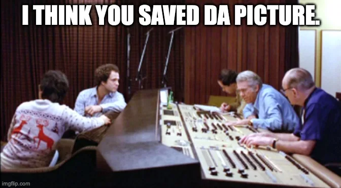 A still from a 1970s TV show shows five people seated around a large, complex audio mixing console in a studio. The person…