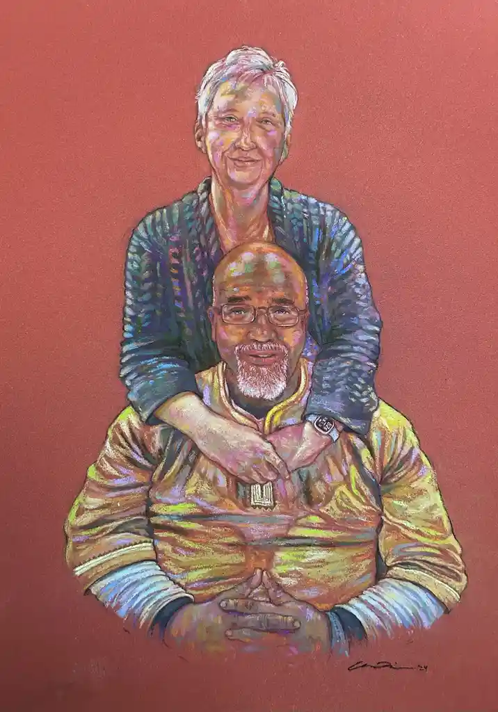 A colorful pastel drawing shows an older woman with short white hair sitting on the shoulders of an older bald man with…