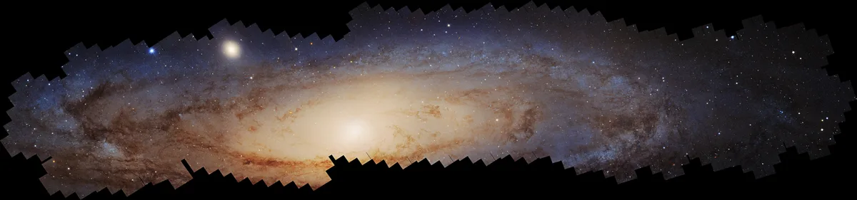A panoramic view of a spiral galaxy, likely the Milky Way, with a bright central bulge and swirling arms filled with stars…