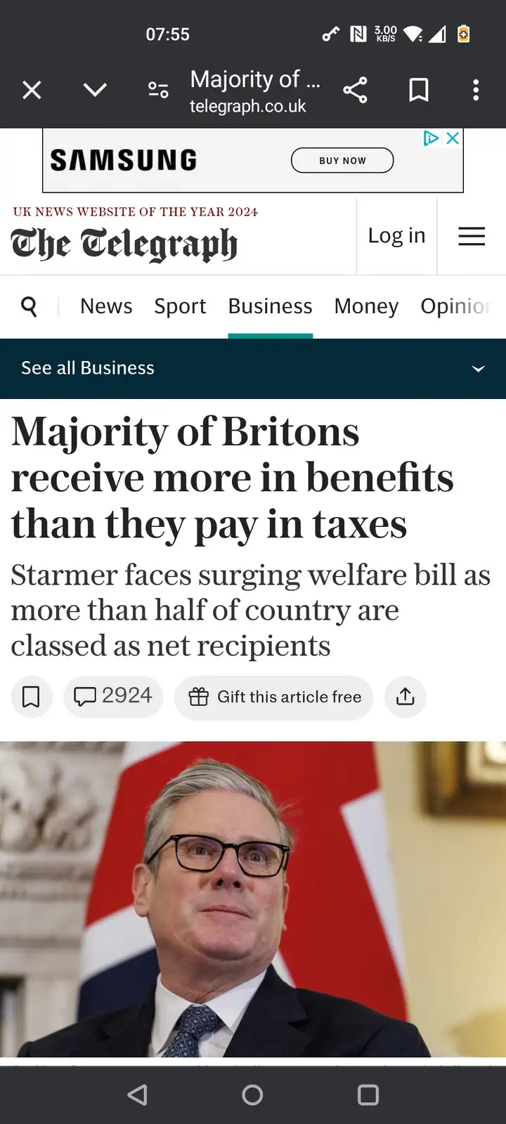 A screenshot of a mobile phone displaying a news article from The Telegraph with the headline 'Majority of Britons receive…