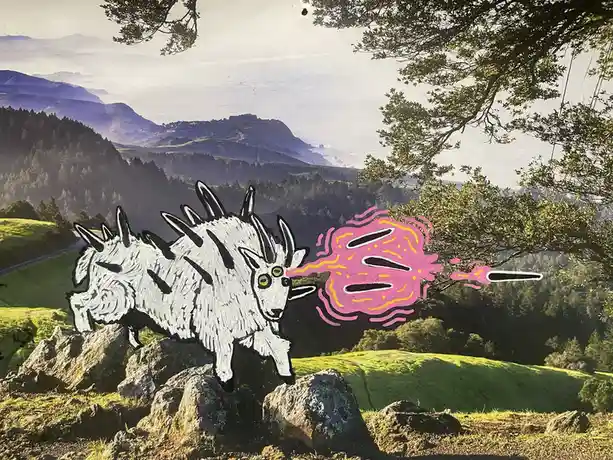 A cartoon-style white goat with black spikes and green eyes stands on rocks in a scenic mountain landscape, blowing a pink…
