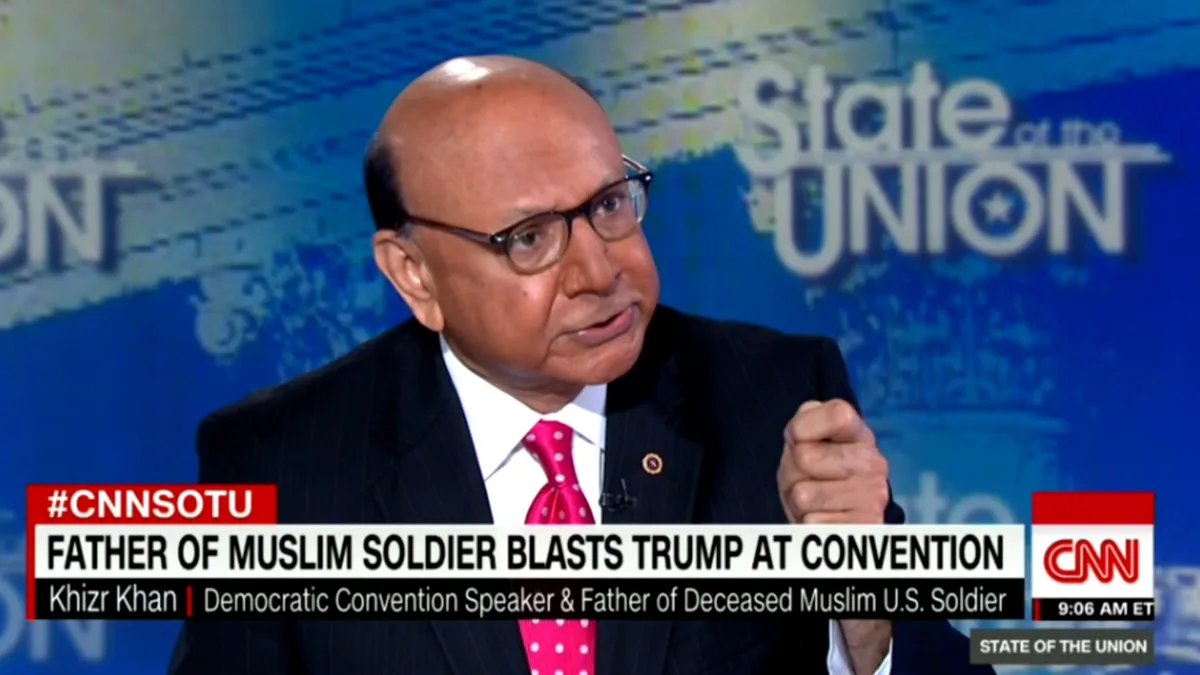 A man in a dark suit and pink polka-dot tie speaks passionately on a CNN 'State of the Union' broadcast, with a lower third…