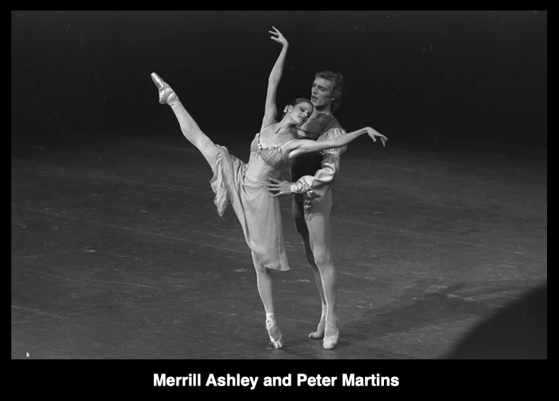 A black-and-white photograph of ballet dancers Merrill Ashley and Peter Martins performing a partnered pose on stage. Ashley…