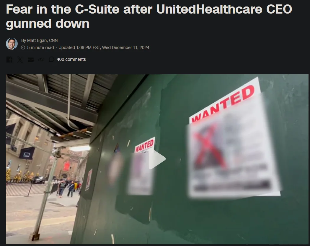 A screenshot of a CNN article header showing a video thumbnail of two 'WANTED' posters taped to a green construction wall…