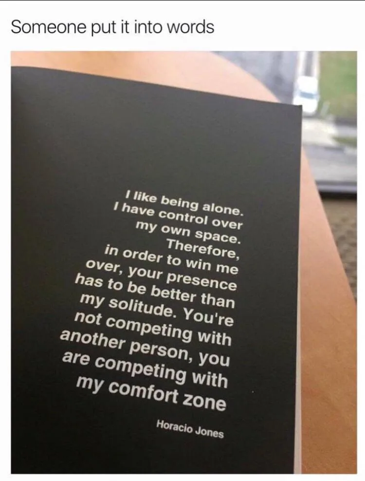 A close-up photo shows a black book or card with white text that reads: 'I like being alone. I have control over my own…