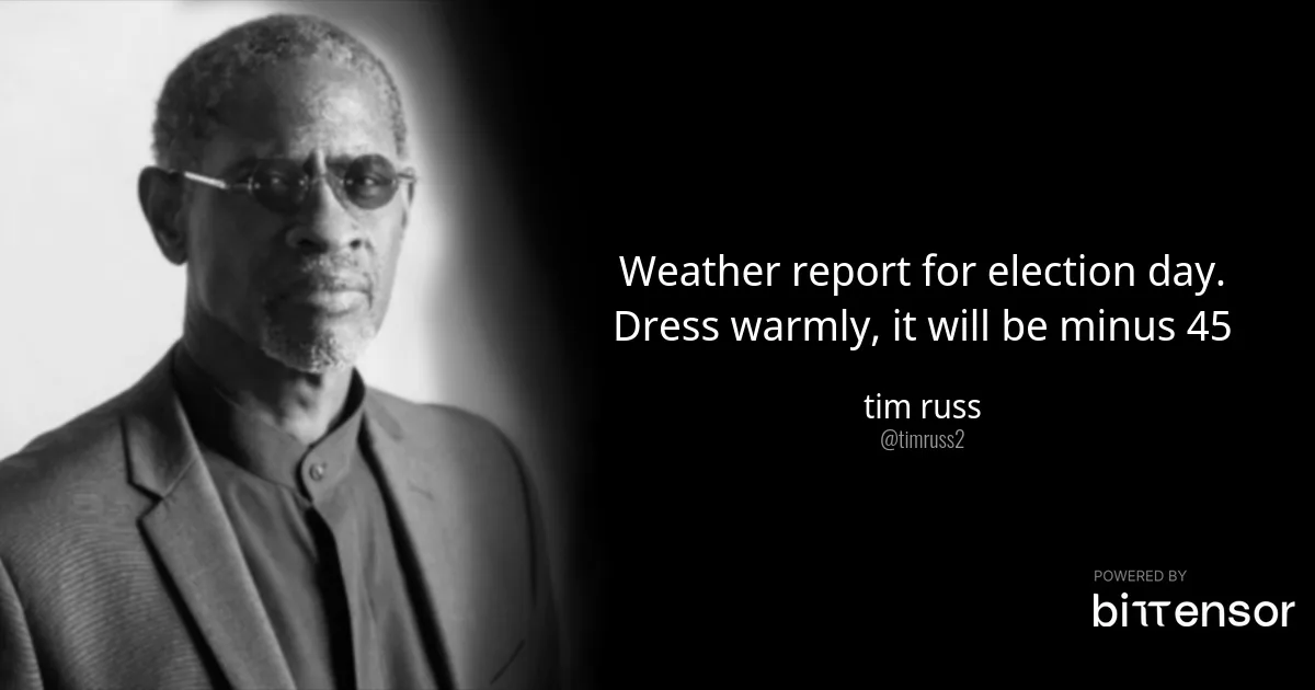 A black and white portrait of actor Tim Russ, who is wearing glasses and a suit, looking directly at the camera. Overlaid…