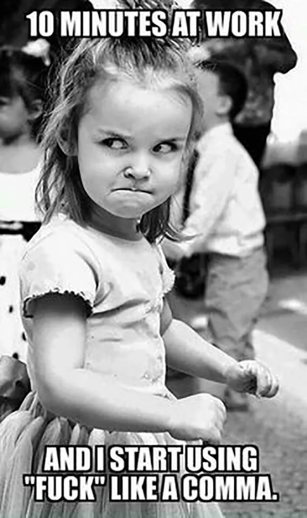 A black-and-white photo of a young girl with a scowling, annoyed expression, her arms crossed and eyes narrowed. The text…