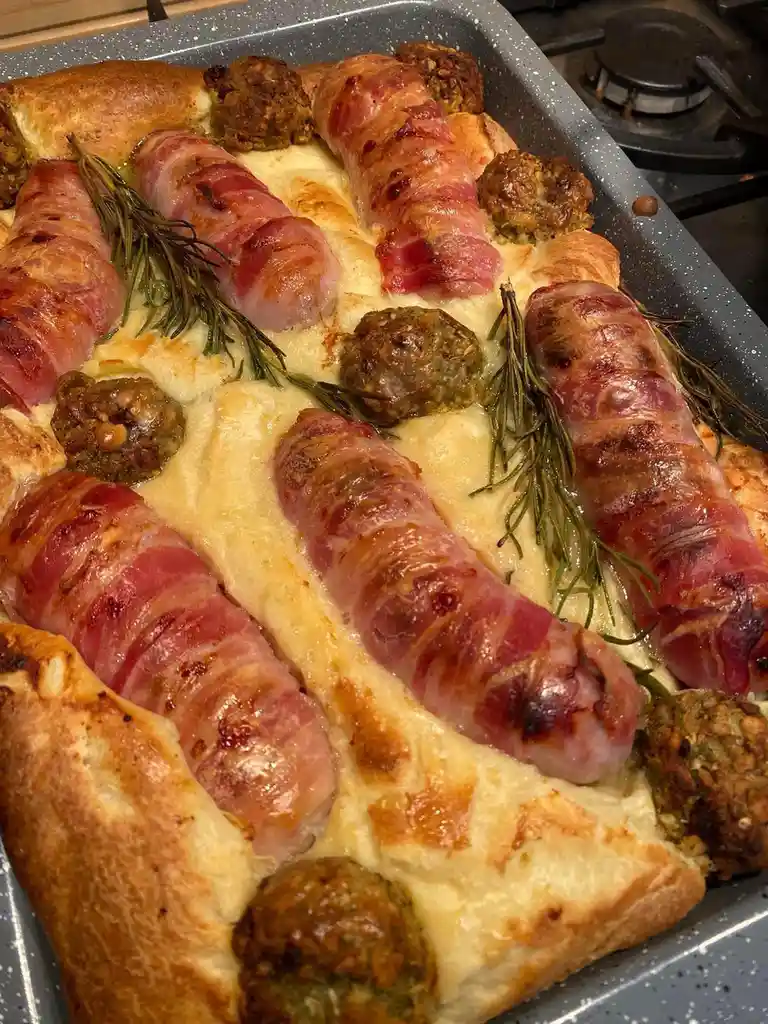 Indulging in pigs in blankets with stuffing, a delightful toad in the hole!
