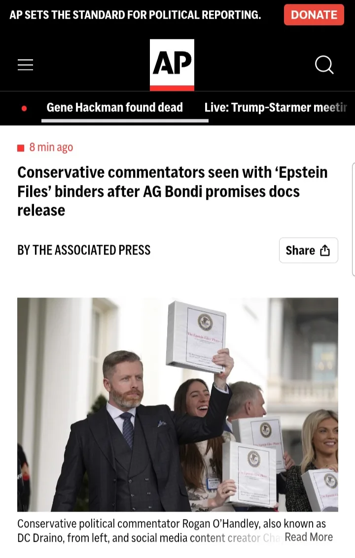 A screenshot of an Associated Press news article shows a man in a suit holding up a binder labeled 'The Epstein Files' while…