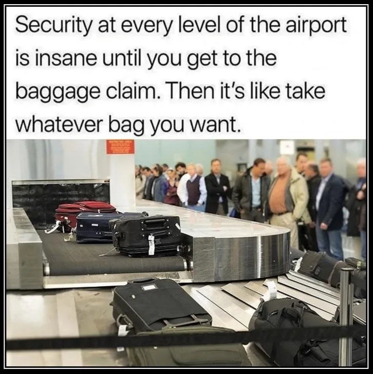 An airport baggage claim carousel with several suitcases moving along it, including red, blue, and black ones. In the…