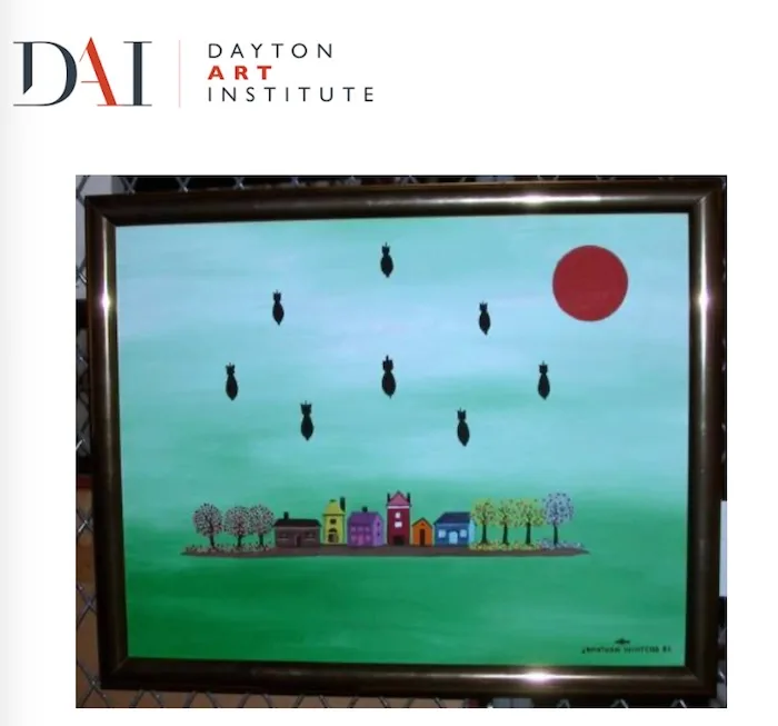A framed painting shows a colorful village with houses and trees under a teal sky, with black bomb silhouettes falling from…
