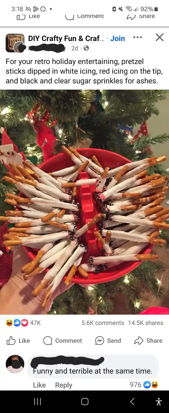 A hand holds a red bowl filled with pretzel sticks dipped in white icing, with red icing tips and black/clear sprinkles…