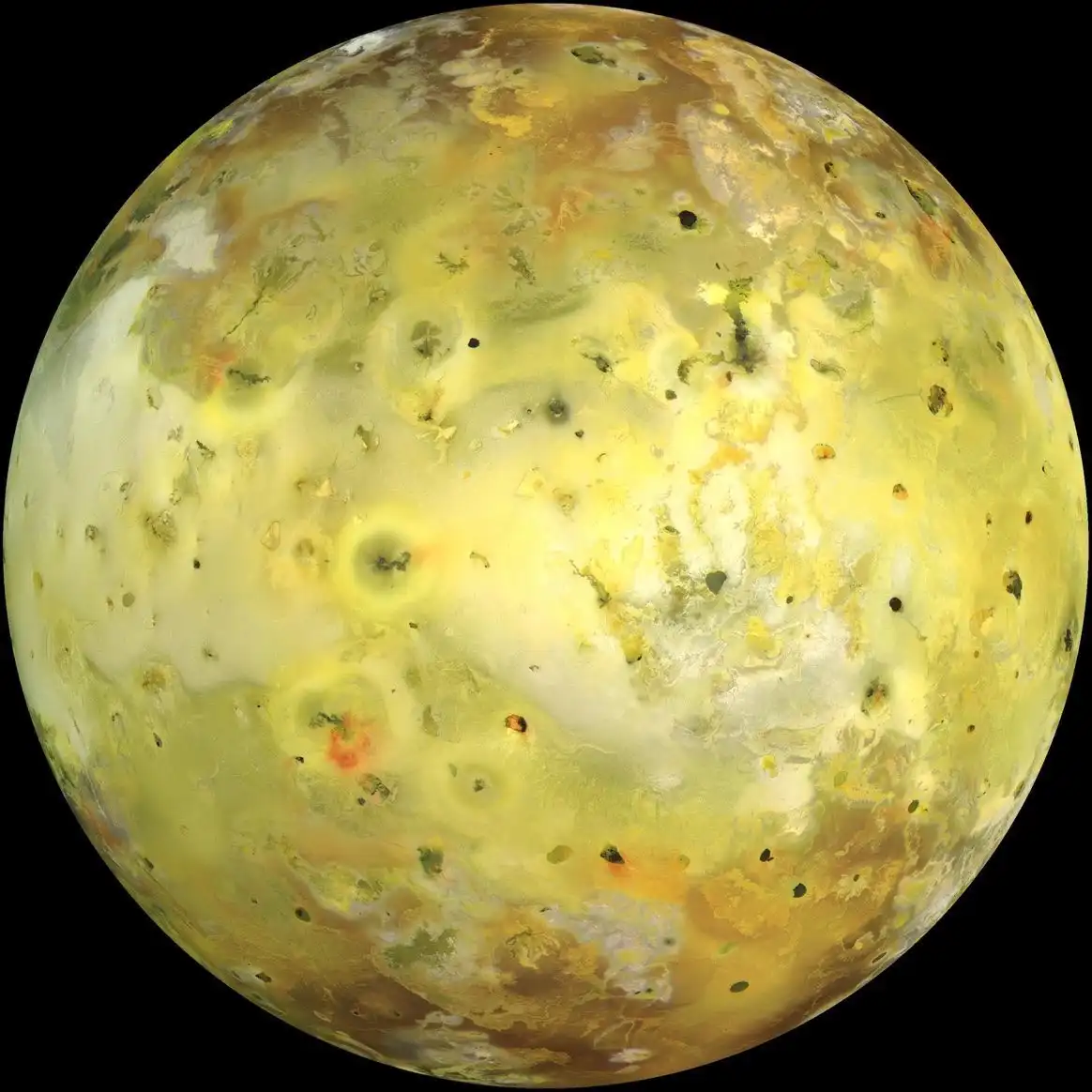 this is a photo of the moon io, which is covered in yellow and white clouds and has many dark spots. the overlaid text reads…